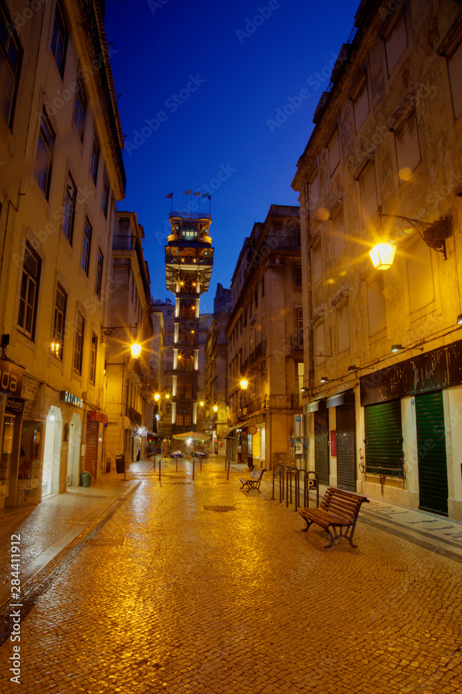 Portugal, Lisbon, Rua Augusta, View of the Elevator in the Square surrounded by Government Buildings, Commerce Square with the Night lights of the City