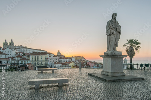 Portugal, Lisbon, Alfama, Largo Portas do Sol at Dawn, Statue of St. Vincent the patron saint of Lisbon