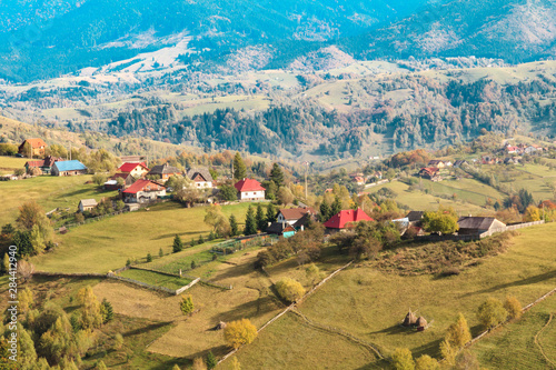 Romania. Magura. Fall colors. Territorial views near road to cave, Hotel Aquila, Moeciu de Jos and Pestera mountain village. photo