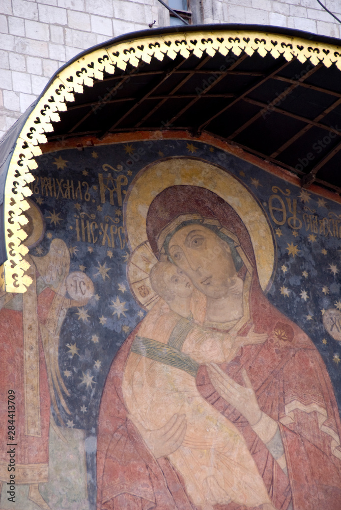 Russia, Moscow, The Kremlin. Cathedral of the Assumption (aka Uspensky sobor) founded in 1326. Southern entrance with fresco painting of Mother of Christ with arch-angels Gabriel & Michael.