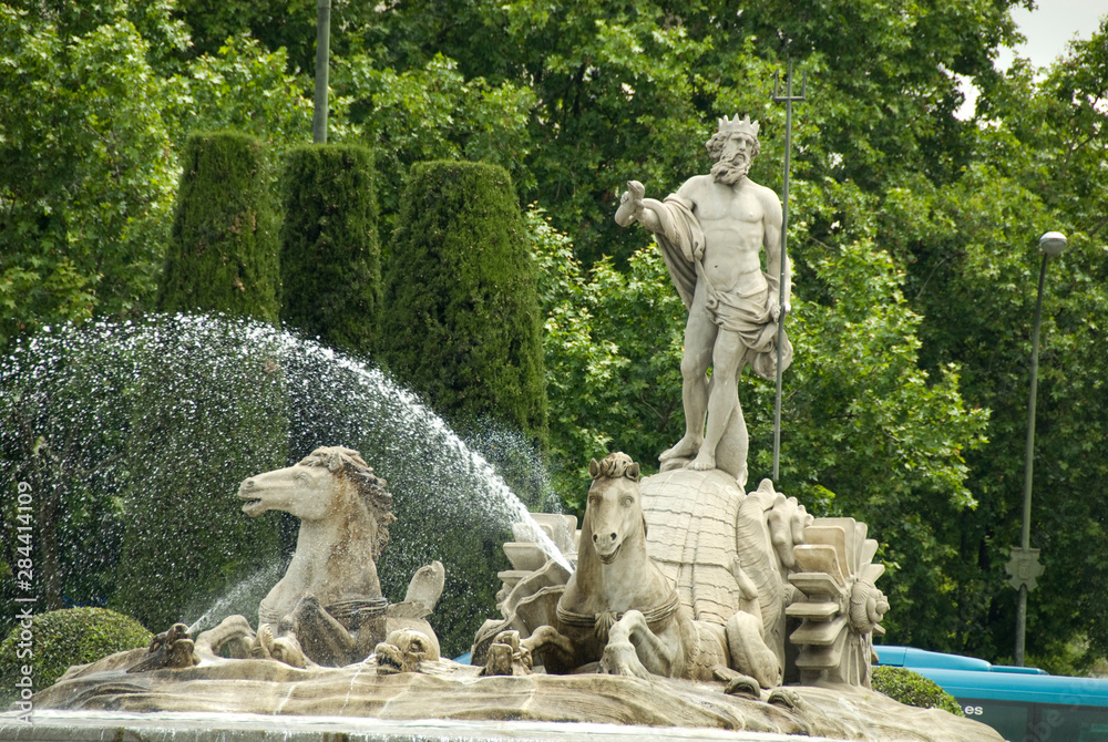 Spain, Madrid. Neptune fountain (aka Neptuno) in Paseo del Prado area.