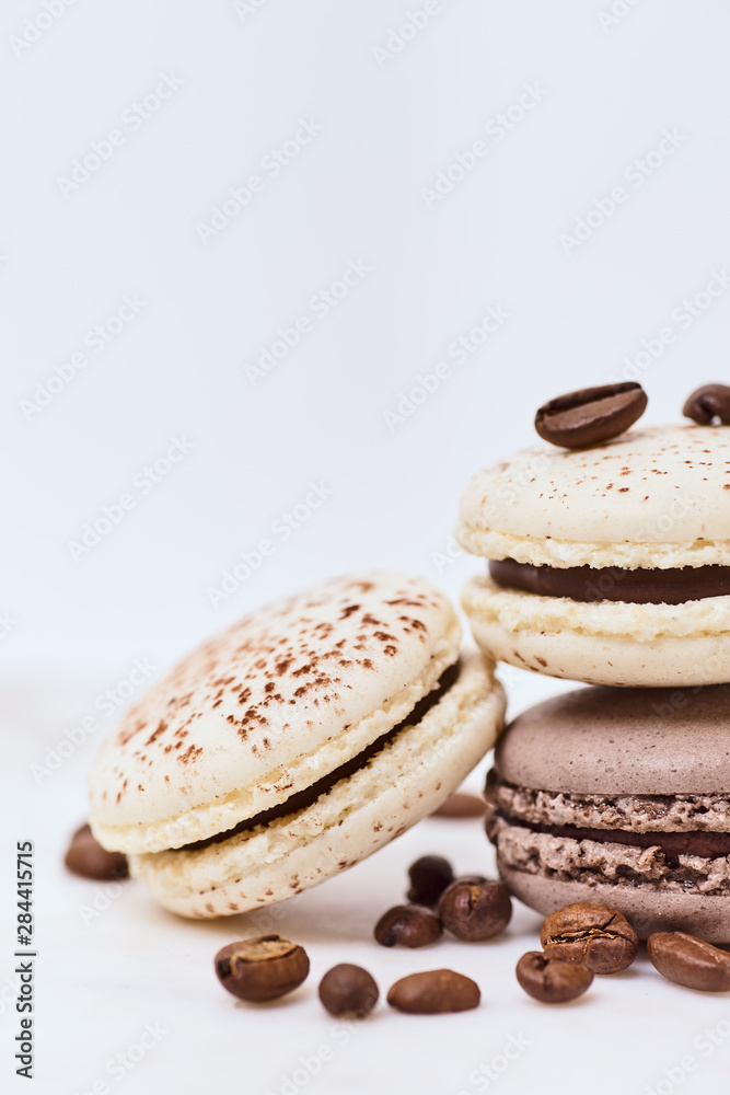 Few colored macarons on a white background