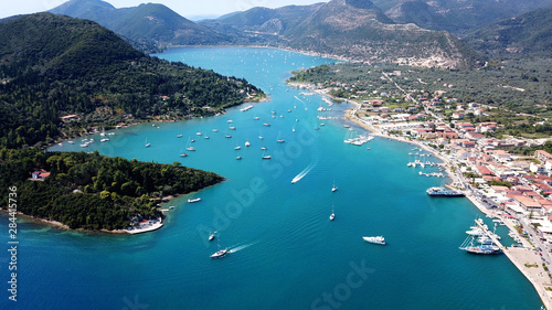 Aerial drone bird's eye view photo of iconic port of Nidry or Nydri a safe harbor for sail boats and famous for trips to Meganisi, Skorpios and other Ionian islands, Leflkada island, Ionian, Greece photo