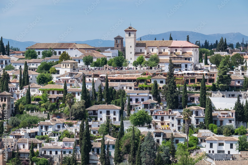 Spain, Andalusia. Granada. View from the Alhambra gardens across town to the matador of San Nicolas.