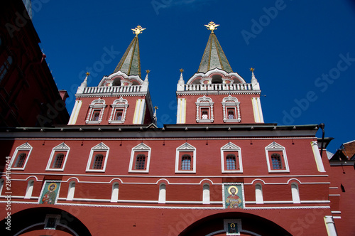 Russia, Moscow, Red Square. Voskresenskie Gate (aka Resurrection Gate), golden double-headed eagles on top of tower, symbol of Russia. 