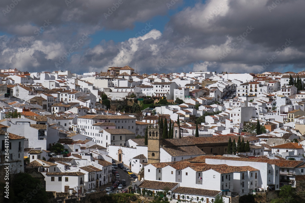 Spain, Andalusia, Ronda. Known for a striking bridge that crosses a ravine and divides the town in two, Ronda is a classic example of a whitewashed hilltop village along the White Road.