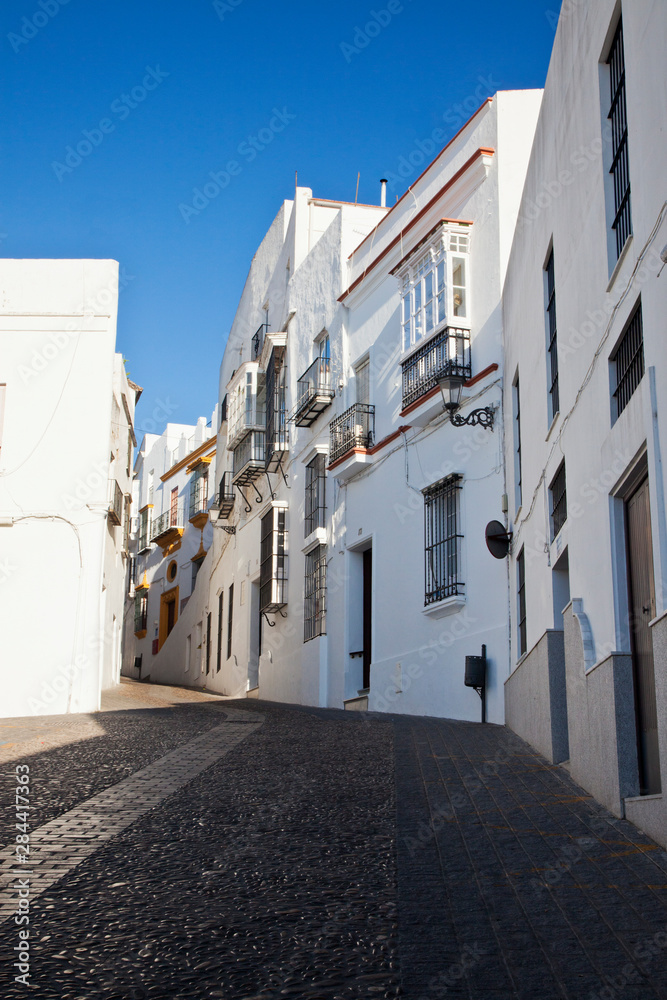 Spain, Andalusia, Cadiz Province, Arcos De la Fontera. Typical narrow streets and whitewashed houses.