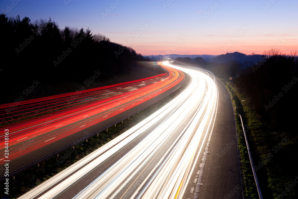 Motorway at dusk, Gloucestershire, UK Motorway at dusk, Gloucestershire, UK