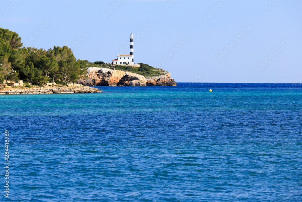 Spain, Balearic Islands, Mallorca. Porto Colom. Lighthouse.