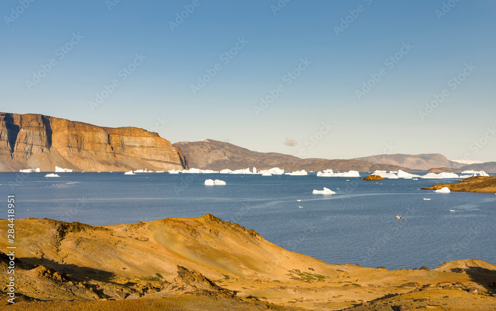 Landscape with icebergs in the Uummannaq fjord system, northwest Greenland.