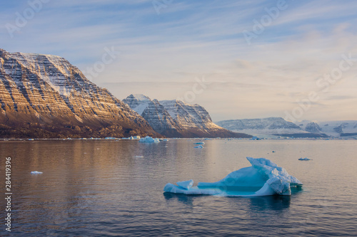 Greenland. Scoresby Sund. Icebergs and deeply eroded mountains. photo