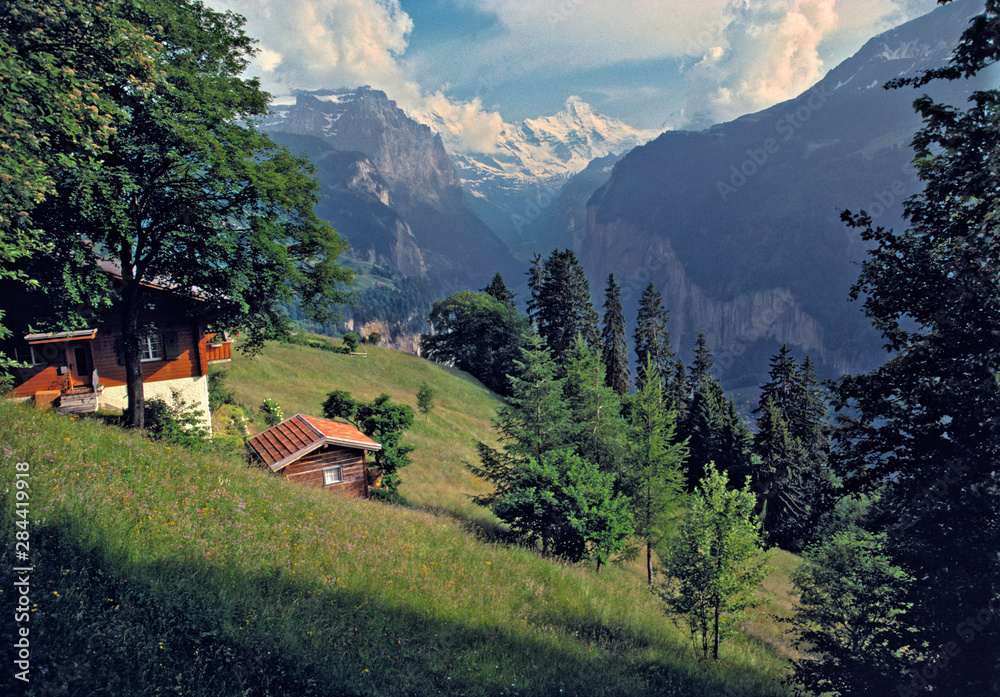 Switzerland, Murren. Visitors in Murren can view the Lauterbrunnen Valley in the Berner Oberland, Switzerland, from the trail.