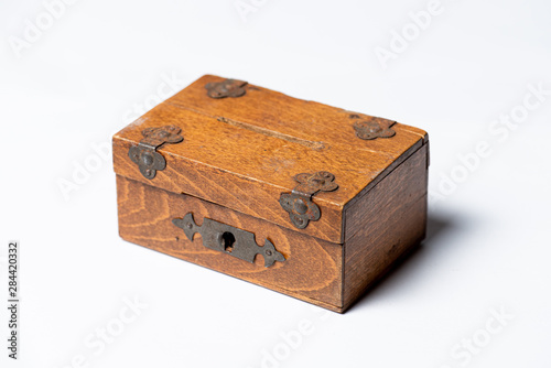Vintage handmade wooden box with lock on white background.