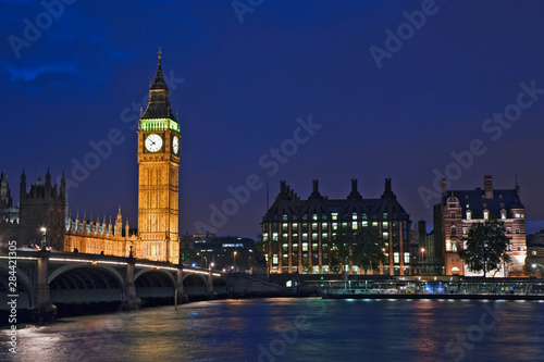 Great Britain, London. View of the Clock Tower or Big Ben at dusk across the Thames River. 
