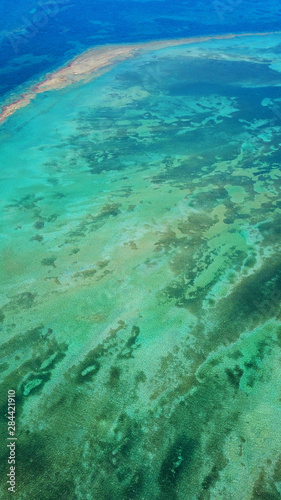 Fototapeta Naklejka Na Ścianę i Meble -  Aerial drone bird's eye view photo of tropical caribbean paradise bay and lagoon with white sandy beach and turquoise clear sea