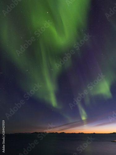 Northern Lights over the colonial harbour. Nuuk, capital of Greenland. © Martin Zwick/Danita Delimont
