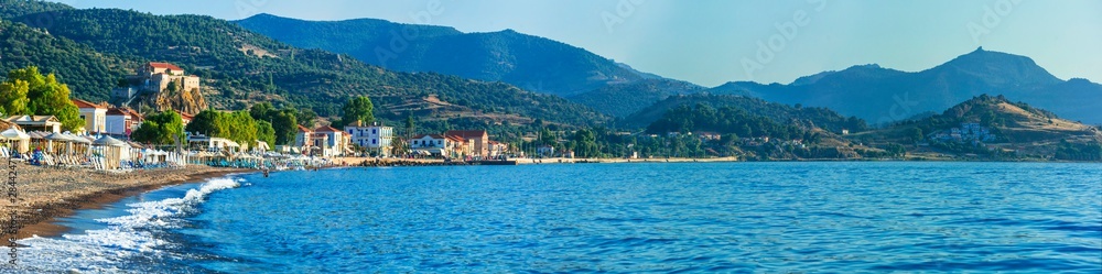 Lesvos island . Greece. Beautiful coastal village Petra with famous monastery on the rock and great beach