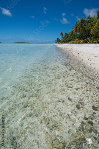 Cook Islands. Palmerston Island, a classic atoll, discovered by Captain Cook in 1774. Current population of 62 people, are all descendants of William Marsters (aka Masters).