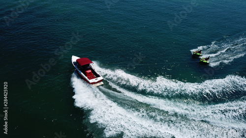 Aerial drone photo of extreme powerboat donut watersports crusing in high speed in tropical turquoise bay © aerial-drone