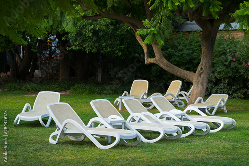 Many white deck chairs © tverkhovynets