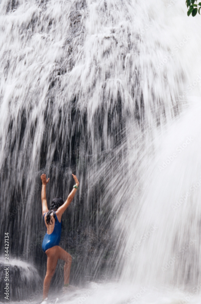 Micronesia, Palau, Babeldaob Island, girl age 13 at Ngatpang Waterfall