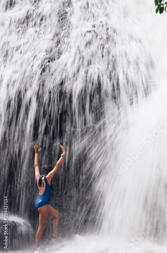 Micronesia, Palau, Babeldaob Island, girl age 13 at Ngatpang Waterfall photo