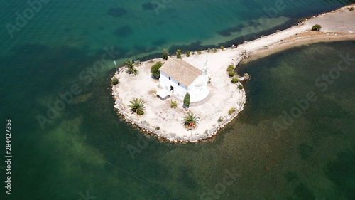 Aerial drone photo of iconic church of Ypapanti built in a small piece of land in bay of Gouvia, Corfu island, Ionian, Greece