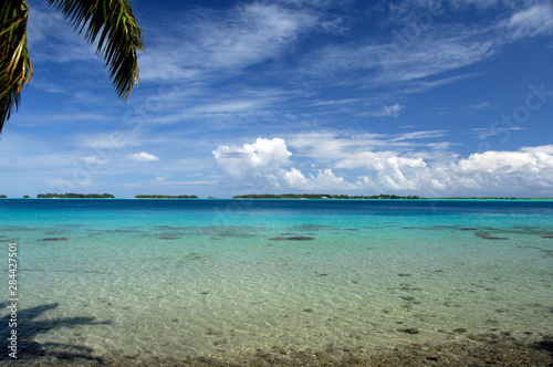 Fototapeta Naklejka Na Ścianę i Meble -  South Pacific, French Polynesia, Society Islands, Bora Bora. View of tiny reef islands (aka motus) that surround the main island of Bora Bora.