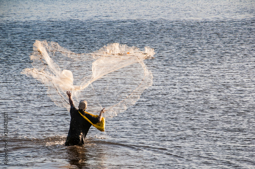 Man fishing in the harbor of Apia, Upolu, Samoa, South Pacific