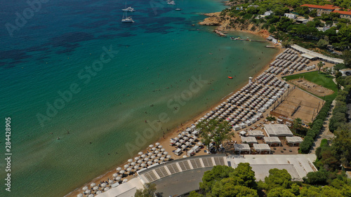 Aerial drone photo from famous Astir or Asteras sandy beach in south Athens riviera, Vouliagmeni Peninsula, Greece