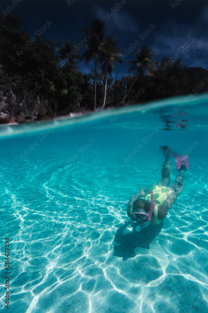 Micronesia, Palau, Snorkeler, Rock Islands at World Heritage Site
