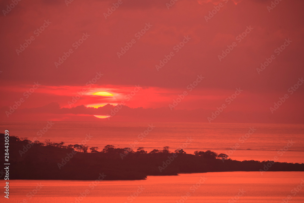 Fototapeta premium Aerial view of sunset and West End of Roatan, Bay Islands, Honduras, Central America