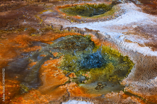Located in the vast pools of geothermal activity at El Tatio, chemicals deep in the earth are creating these textures and colors.