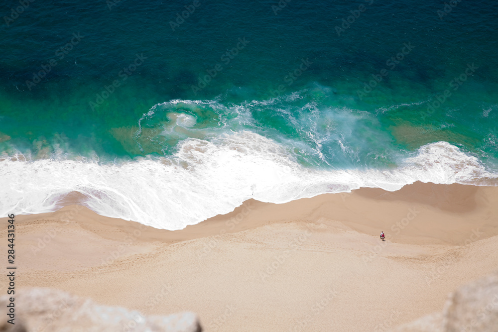 Cabo San Lucas, Baja California Sur, Mexico - High angle view of the waves coming in on the beach.