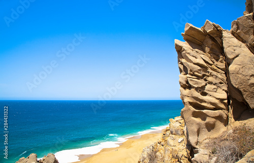 Cabo San Lucas, Baja California Sur, Mexico - A beach with a large rock formation.