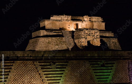 North America, Mexico, Yucatan, Uxmal. The Pyramid of the Magician (Piramide del Advino) as seen from the Nunnery during the nightly sound and light show photo