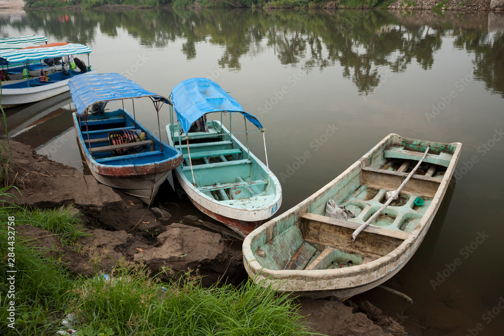 Mexico, Veracruz, La Antigua. Fishing and tour boats line the shore of La Antigua River.