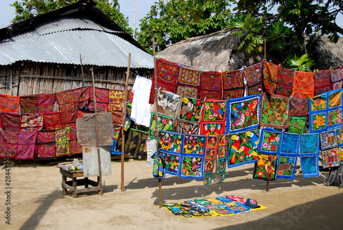 Central America, Panama, San Blas Islands (aka Kuna Yala). Colorful Kuna Indian hand stitched molas on display.