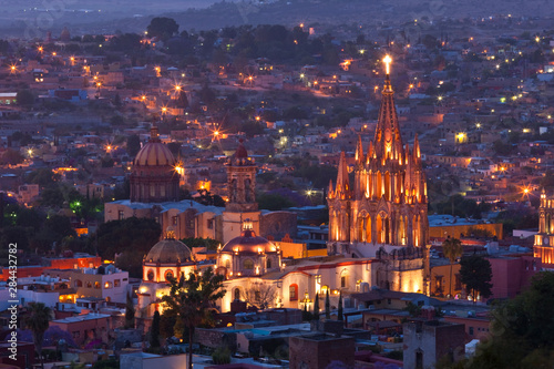 Mexico, San Miguel de Allende. La Parroquia de San Miguel Arcangel Church dominates the city at twilight. photo