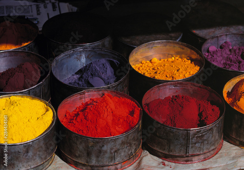 Peru, Huaylas. Pots of dye offer the shopper a variety of colors at the market in Huaraz, Huaylas Valley, Peru photo