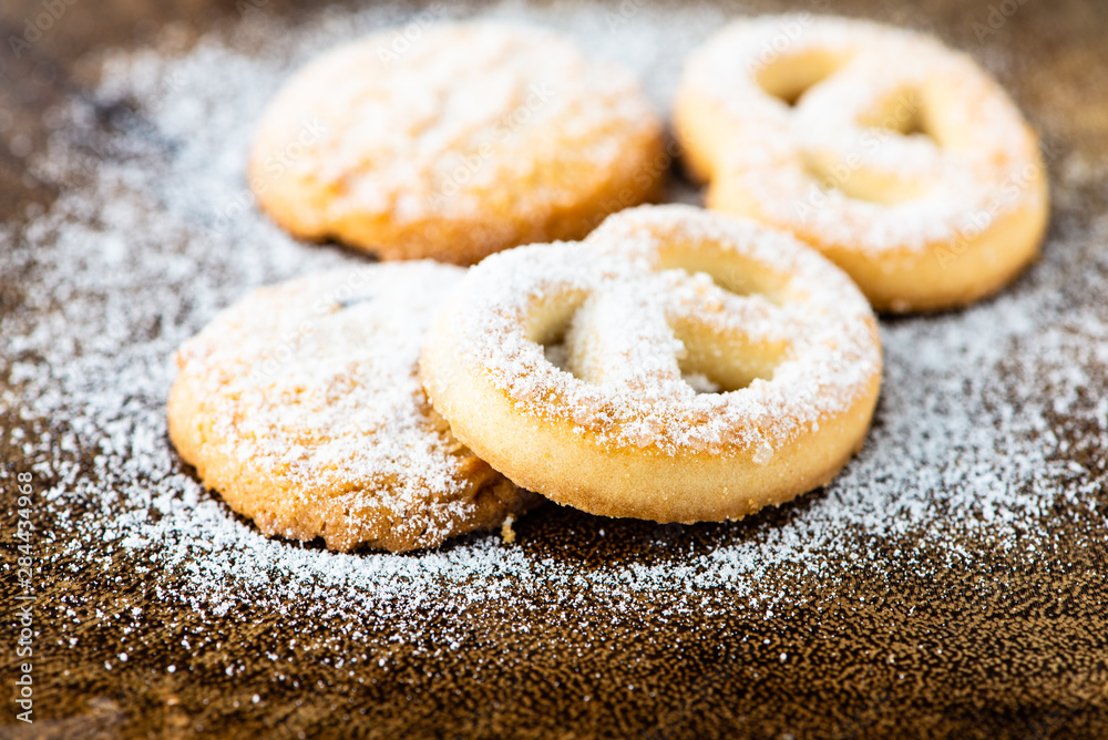 cookies with icing sugar and wood background cookies with icing sugar and wood background