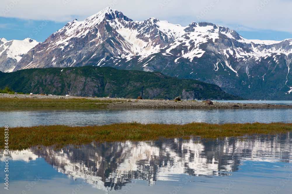 USA, Alaska, Glacier Bay National Park. Mountains reflect in tidal flats. Credit as: Don Paulson / Jaynes Gallery / DanitaDelimont.com
