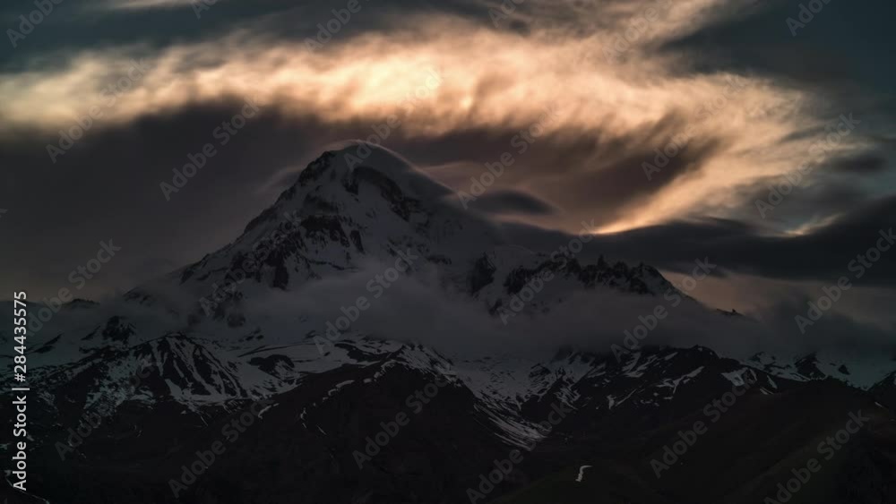 timelapse of the sunset in the mountains that are covered with snow timelapse of the sunset in the mountains that are covered with snow