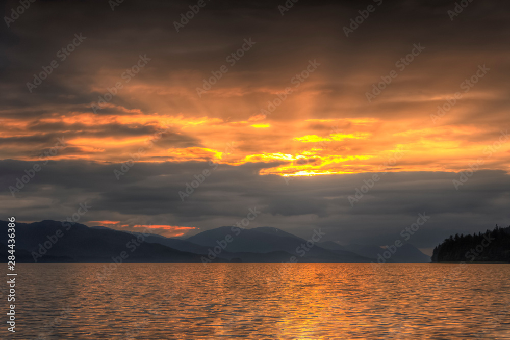 God beams at sunset, Tenakee Inlet, Inside Passage, Southeast Alaska, USA