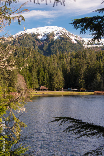 US  Alaska  Ketchikan. Snow capped mountain of Coast Range in Tongass National Forest seen from Ward Lake Trail