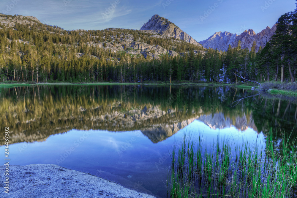 USA, California, Sierra Nevada Mountains. Calm reflections in Grass Lake. 