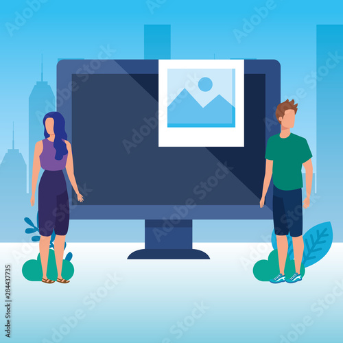 young couple with desktop characters photo