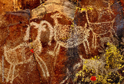 USA, California, Little Petroglyph Canyon, Ridgecrest. Wall of ancient petroglyph rock carvings.  photo