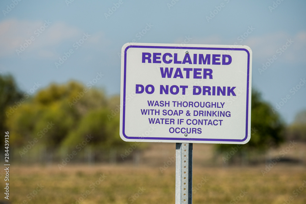 USA, California, Central Valley, San Joaquin River Valley, near Helm Canal Road (between Firebaugh and Mendota), sign for non-potable reclaimed water