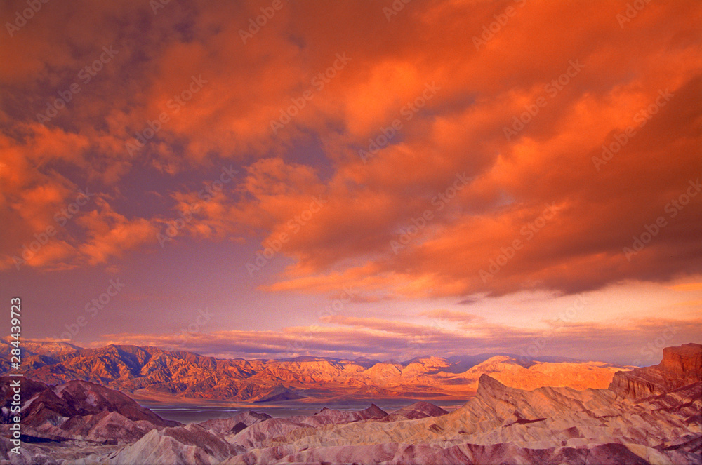 USA, California. View from Zabriske Point of Death Valley National Parkstorm clouds at sunrise. 